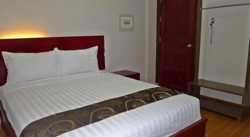 Bed in Rovic's Tourist Hotel