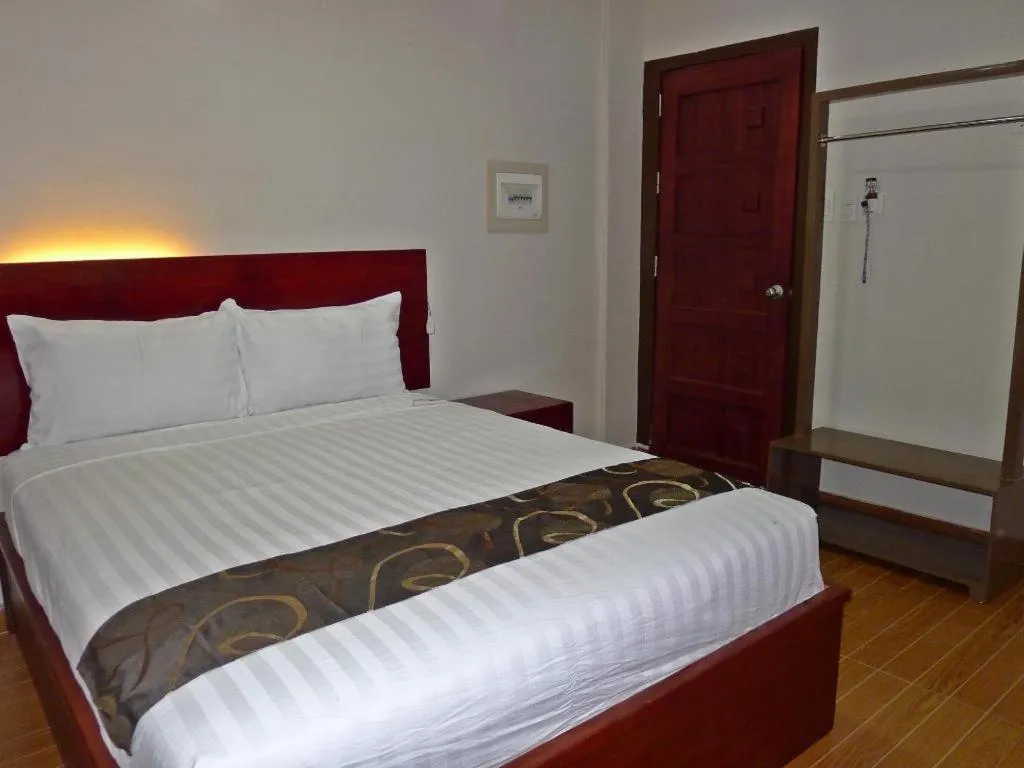 Bed in Rovic's Tourist Hotel
