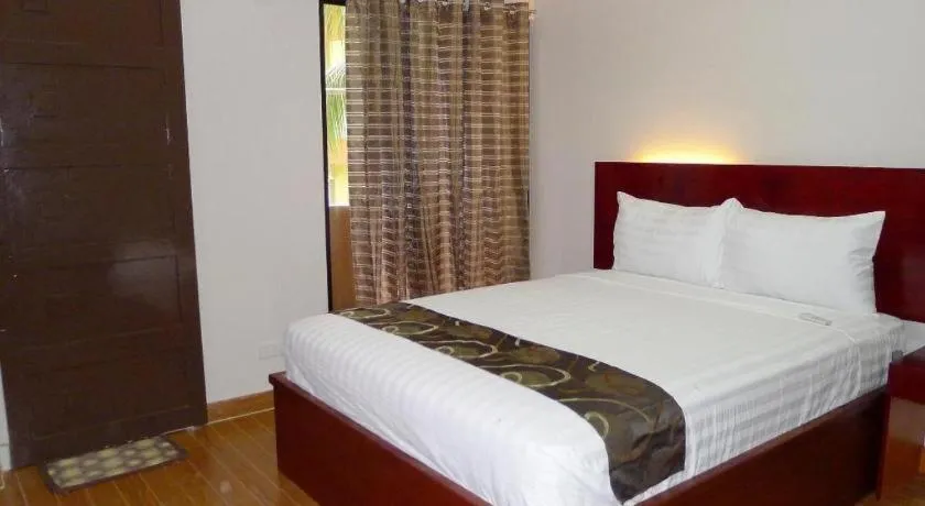 Bed in Rovic's Tourist Hotel