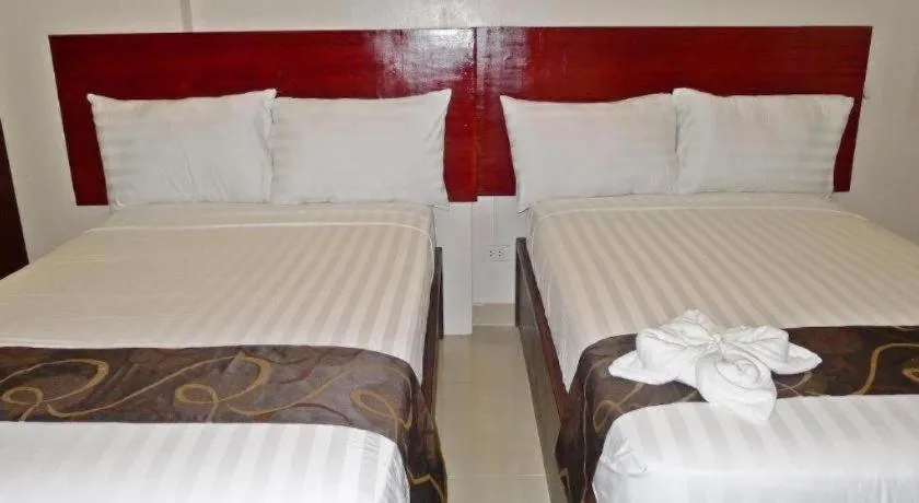 Bed in Rovic's Tourist Hotel