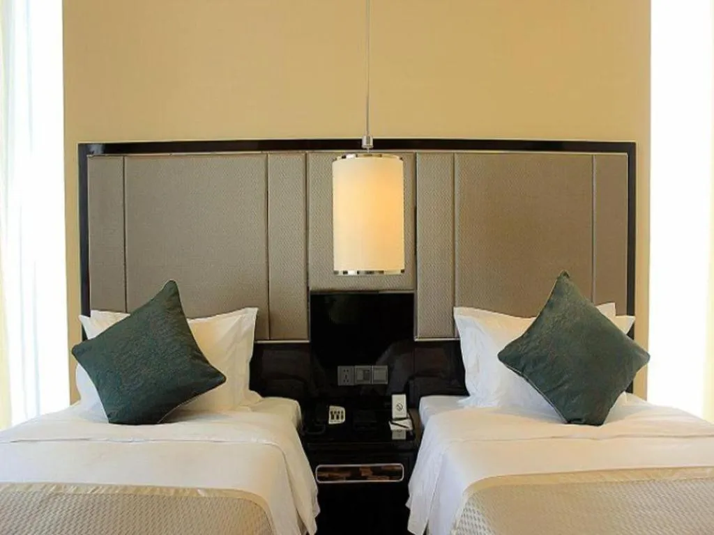 Bed in Pacific Regency Hotel Shenyang