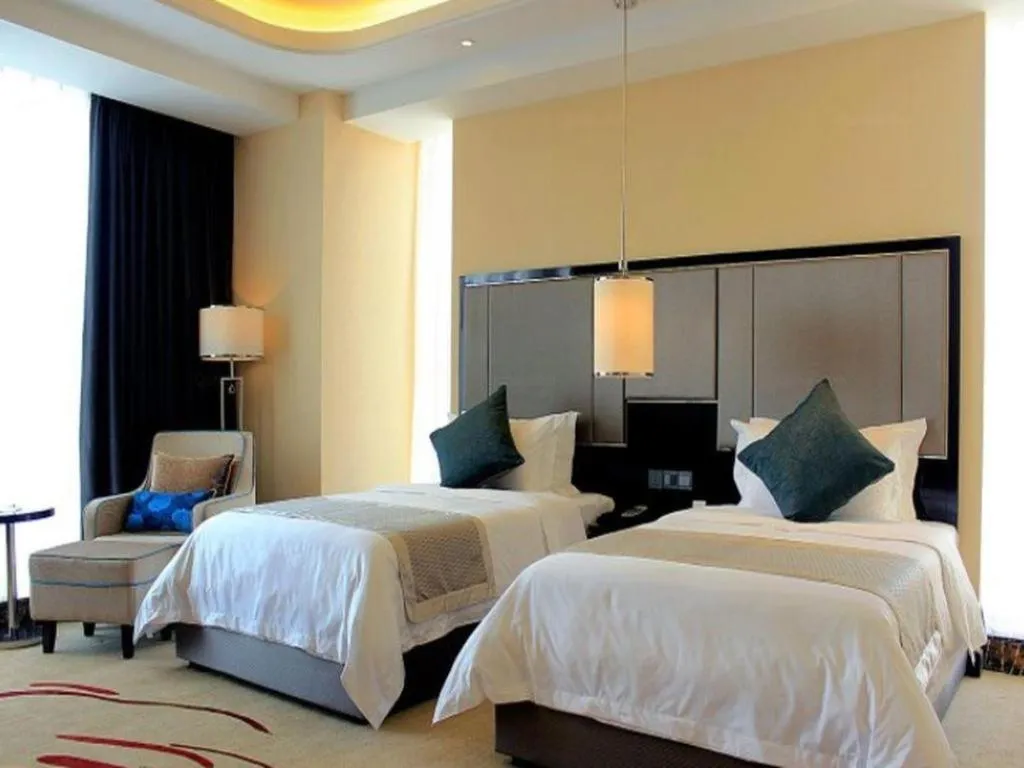 Bed in Pacific Regency Hotel Shenyang