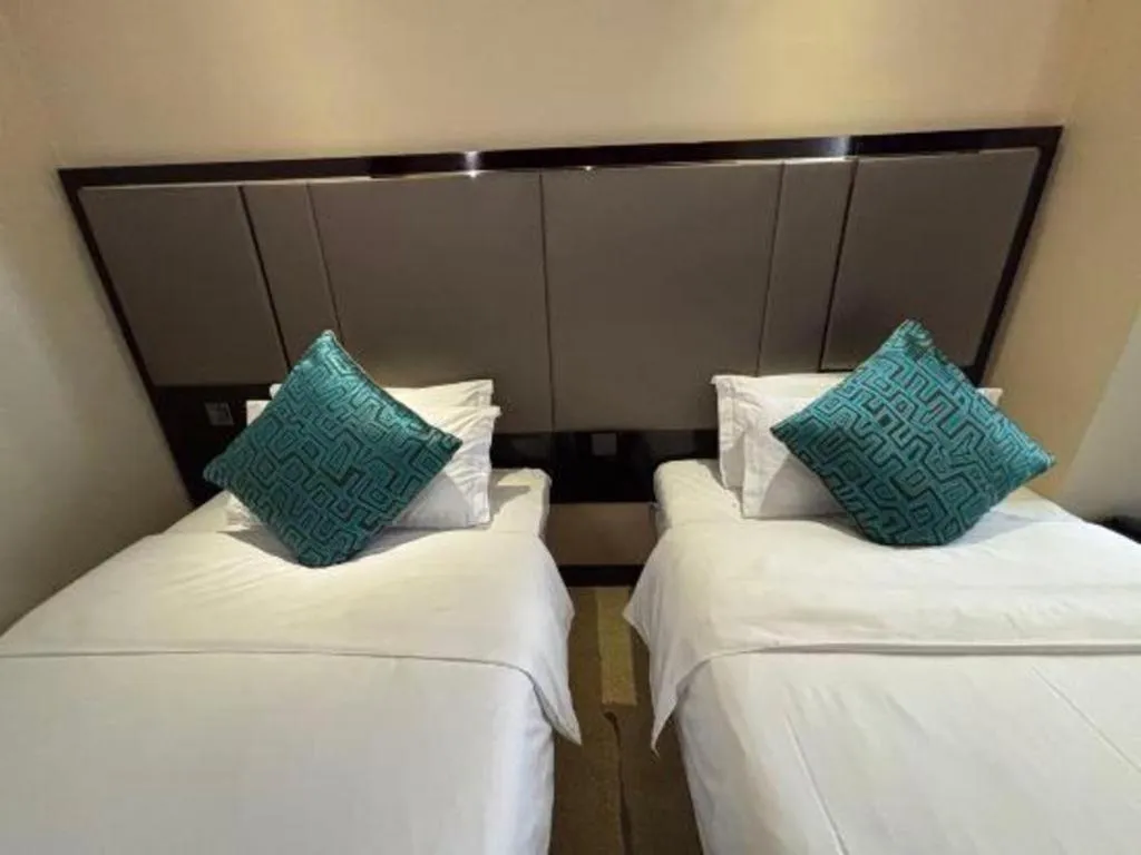 Bed in Pacific Regency Hotel Shenyang