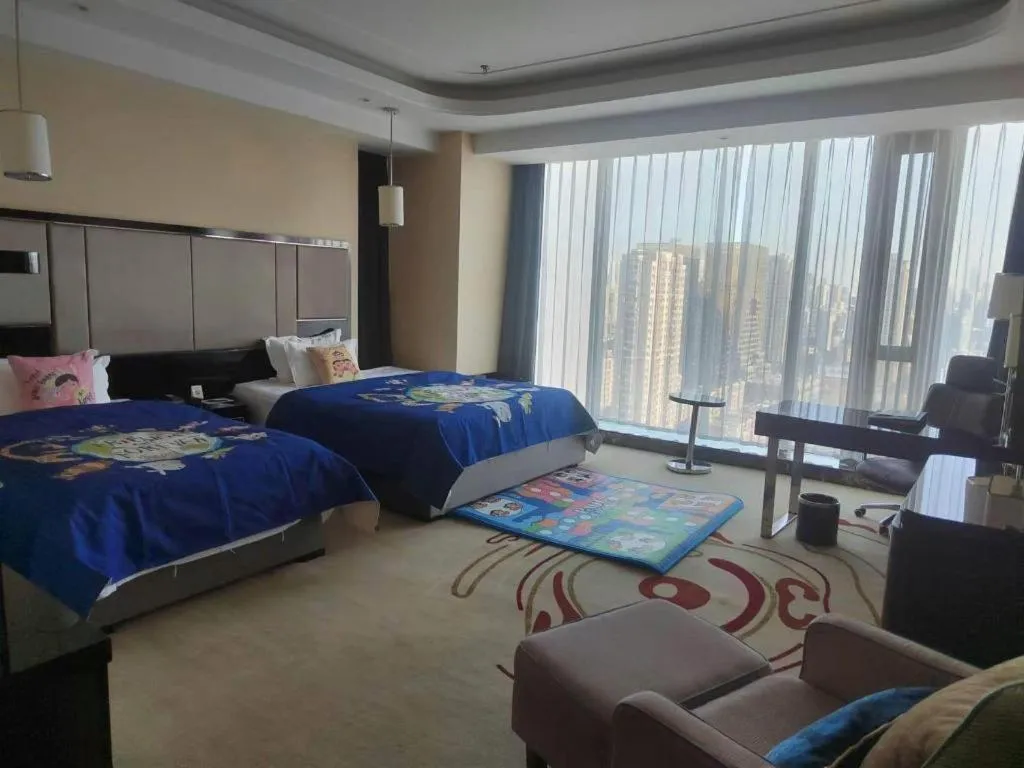 Bed in Pacific Regency Hotel Shenyang