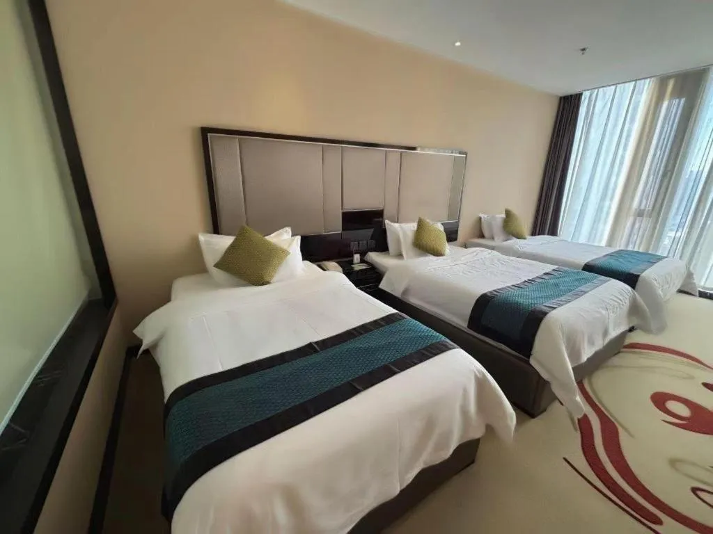 Bed in Pacific Regency Hotel Shenyang