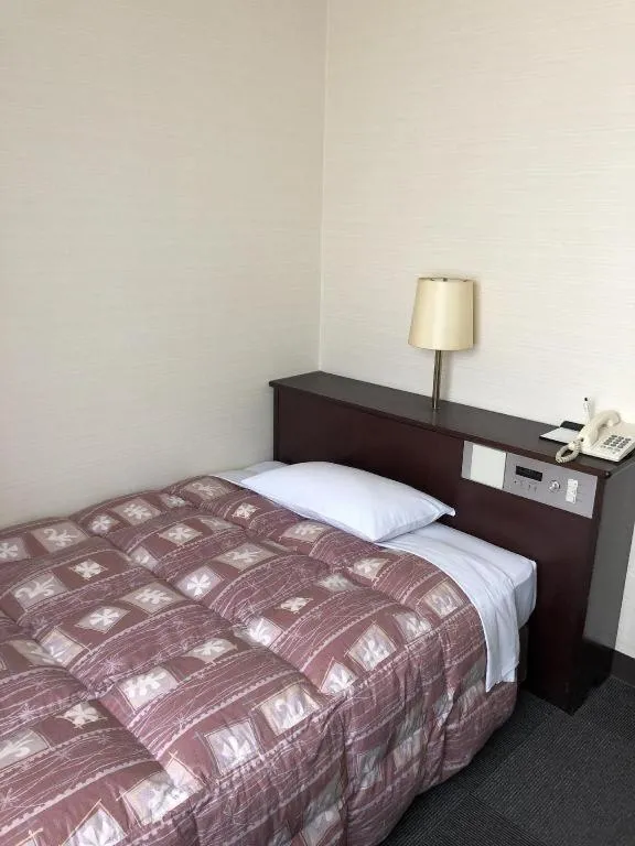 Bed in Hotel Town Nishikigawa