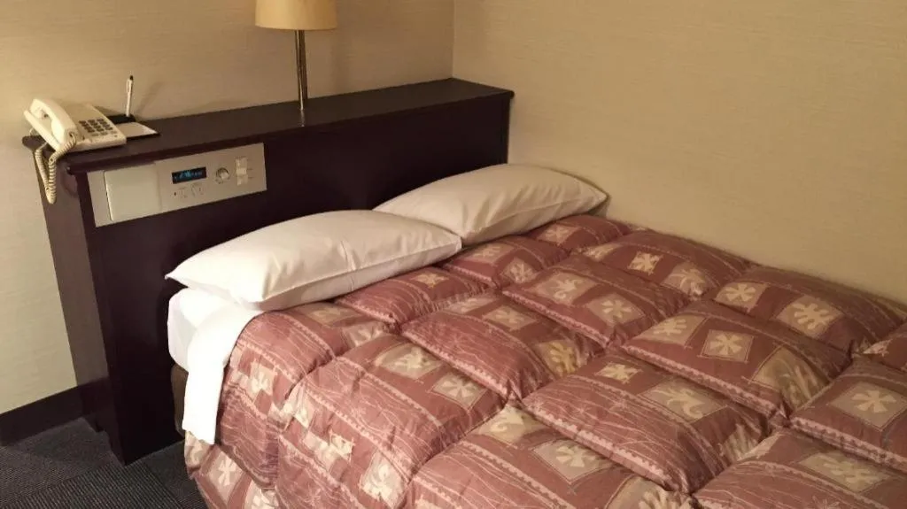 Bed in Hotel Town Nishikigawa