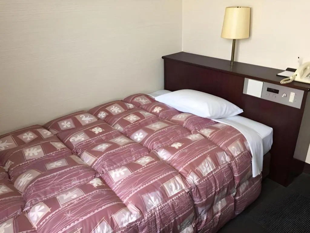 Bed in Hotel Town Nishikigawa