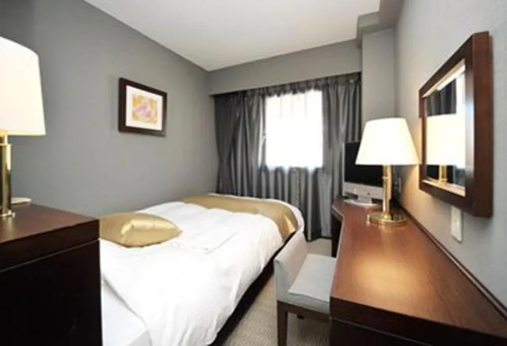 Bed in Welcome Hotel Kochi