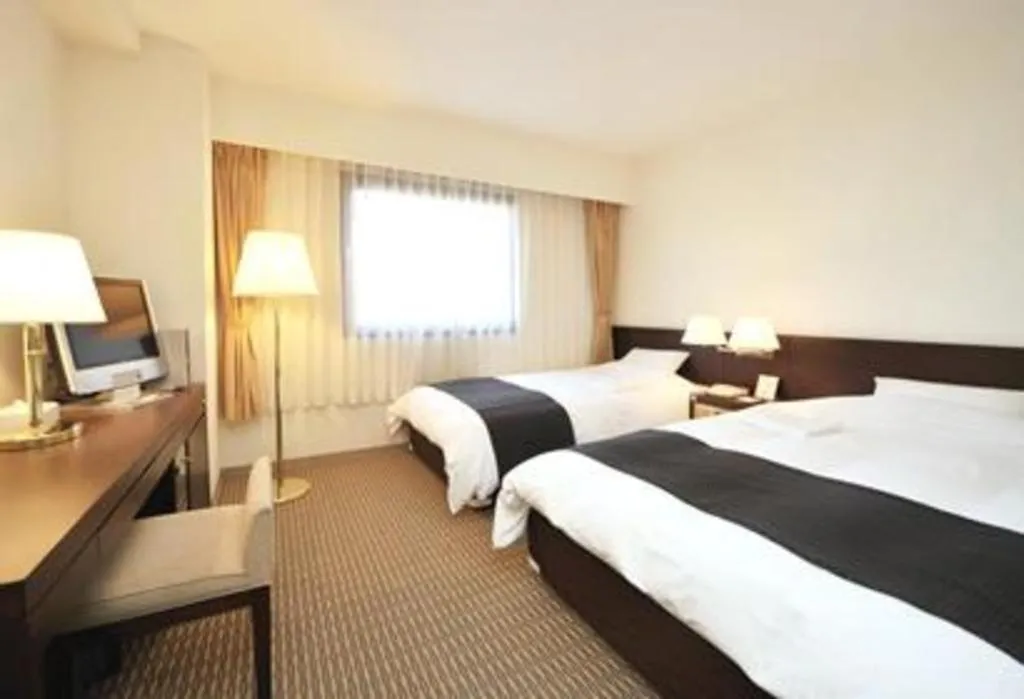 Bed in Welcome Hotel Kochi