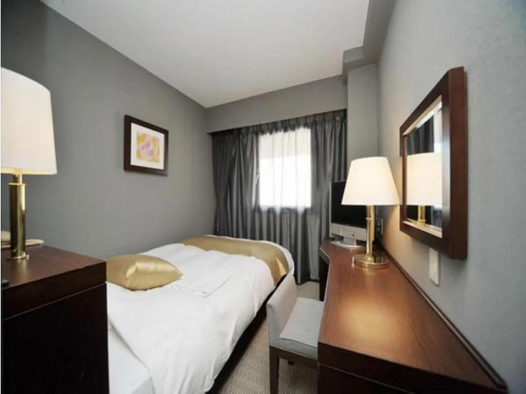 Bed in Welcome Hotel Kochi