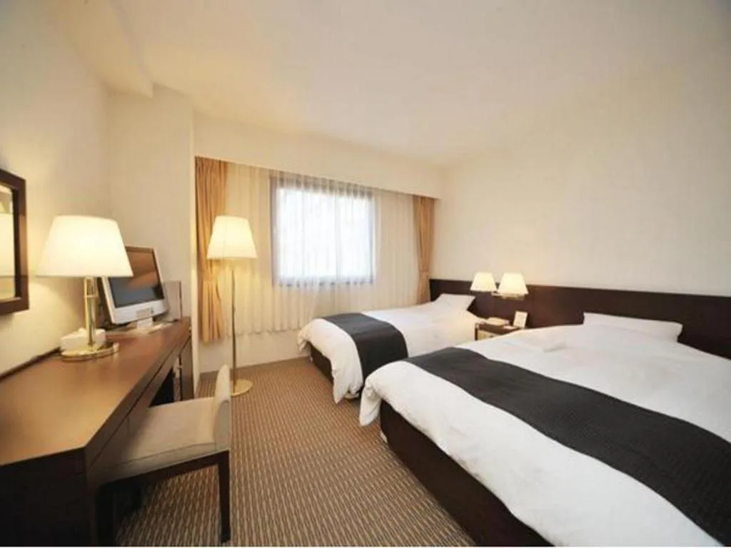 Bed in Welcome Hotel Kochi