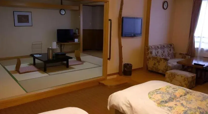 Bed in Kirishima Onsen Ryokojin Sanso Bed in Kirishima Onsen Ryokojin Sanso