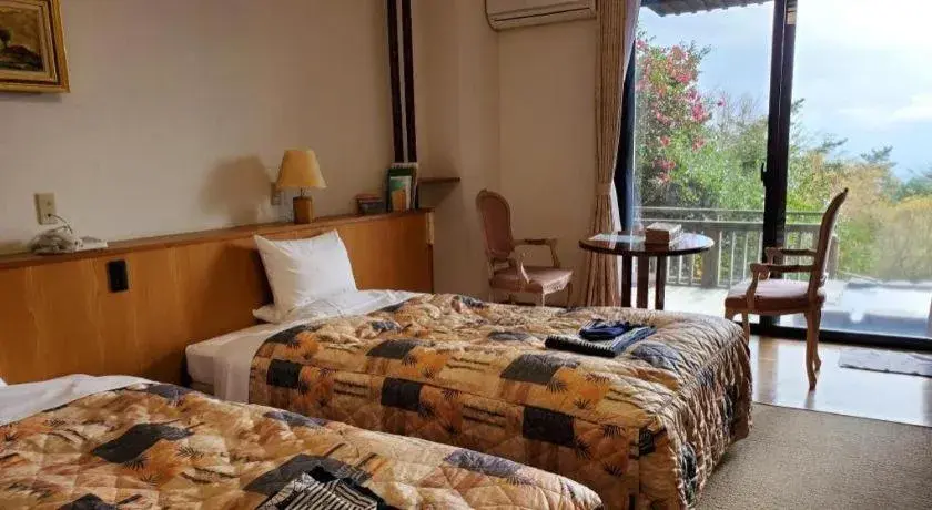 Bed in Kirishima Onsen Ryokojin Sanso Bed in Kirishima Onsen Ryokojin Sanso