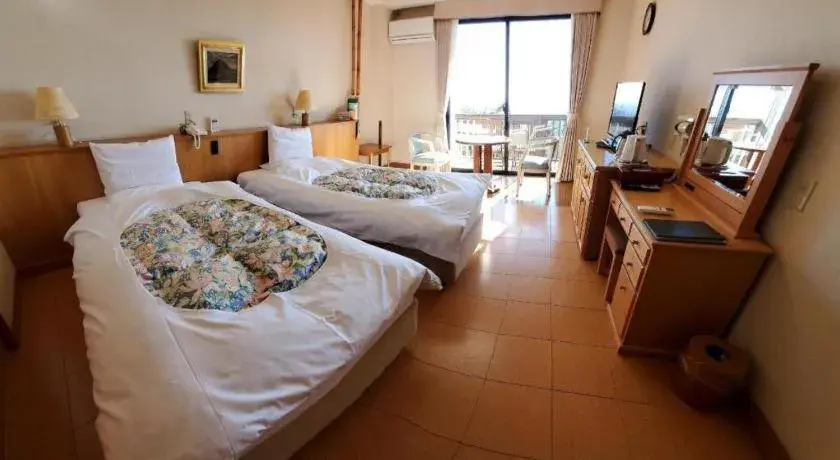 Bed in Kirishima Onsen Ryokojin Sanso Bed in Kirishima Onsen Ryokojin Sanso