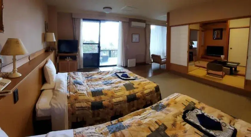 Bed in Kirishima Onsen Ryokojin Sanso Bed in Kirishima Onsen Ryokojin Sanso