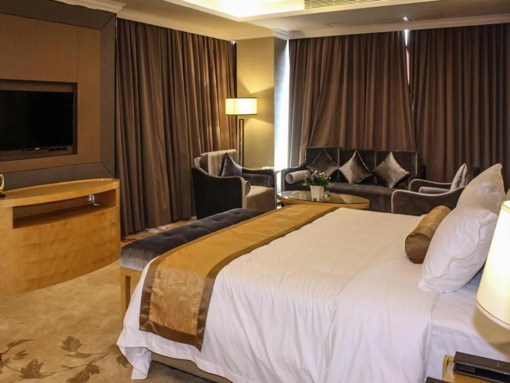 Bed in Golden Phoenix International Hotel