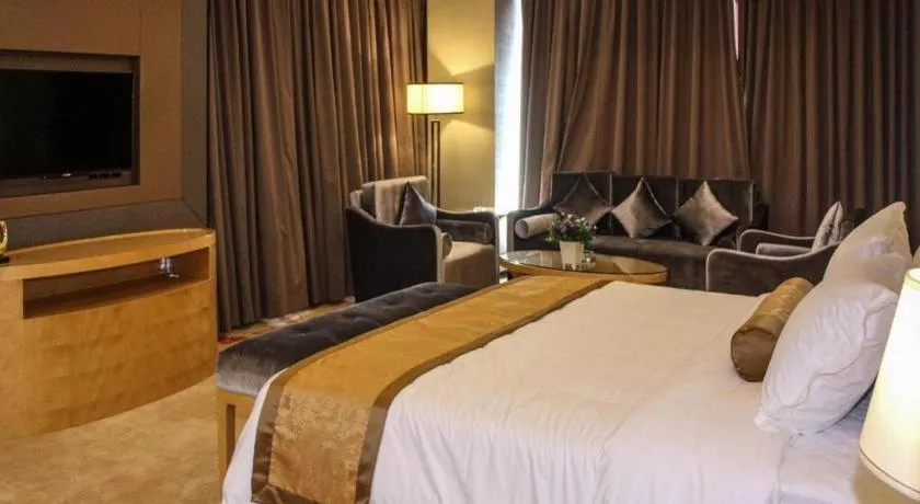 Bed in Golden Phoenix International Hotel