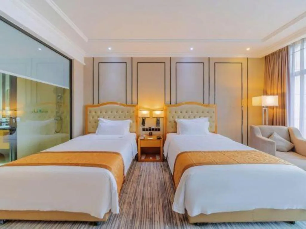 Bed in Golden Phoenix International Hotel