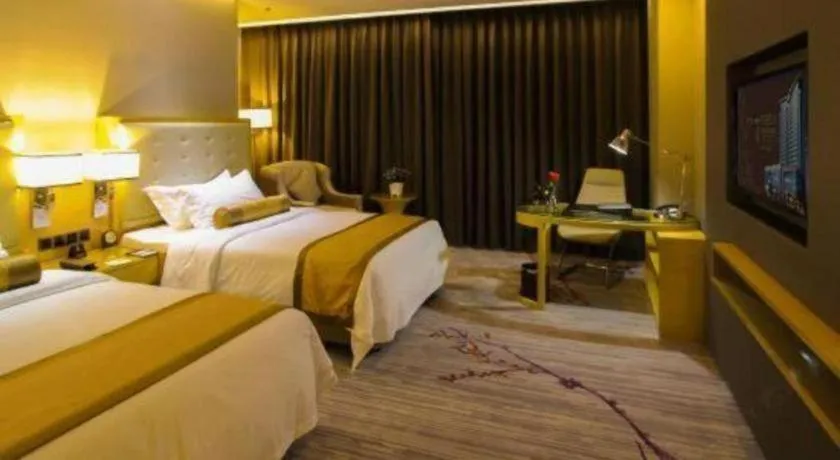 Bed in Golden Phoenix International Hotel