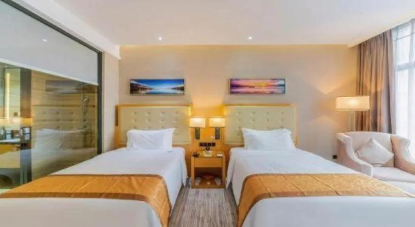 Bed in Golden Phoenix International Hotel