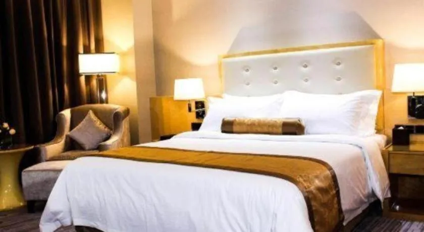 Bed in Golden Phoenix International Hotel