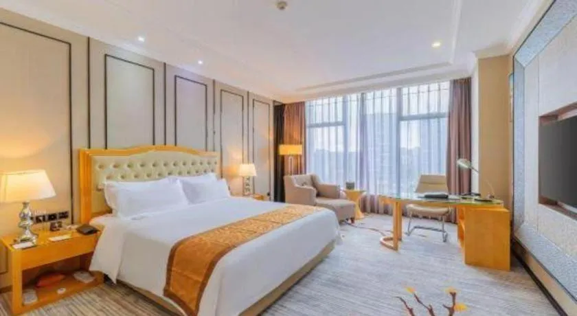 Bed in Golden Phoenix International Hotel