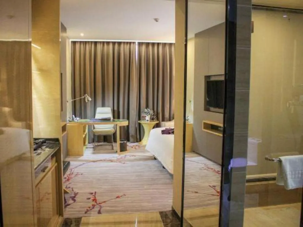 Bed in Golden Phoenix International Hotel