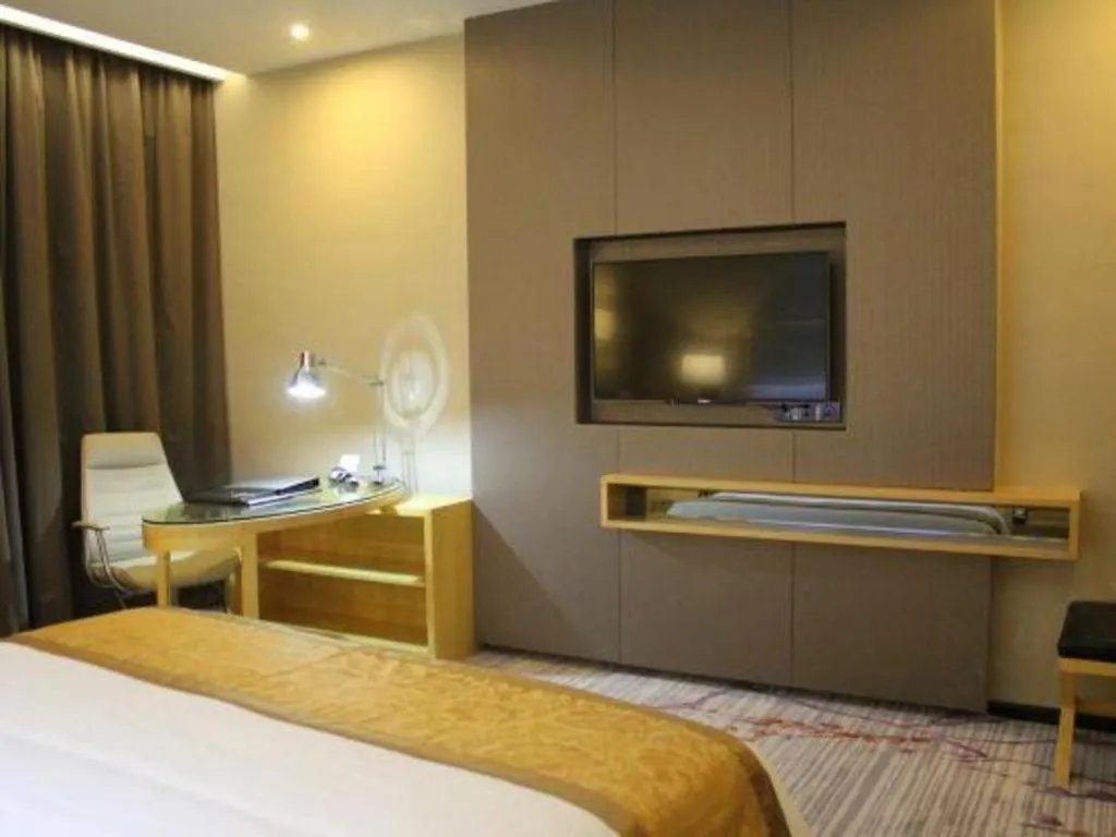 Bed in Golden Phoenix International Hotel
