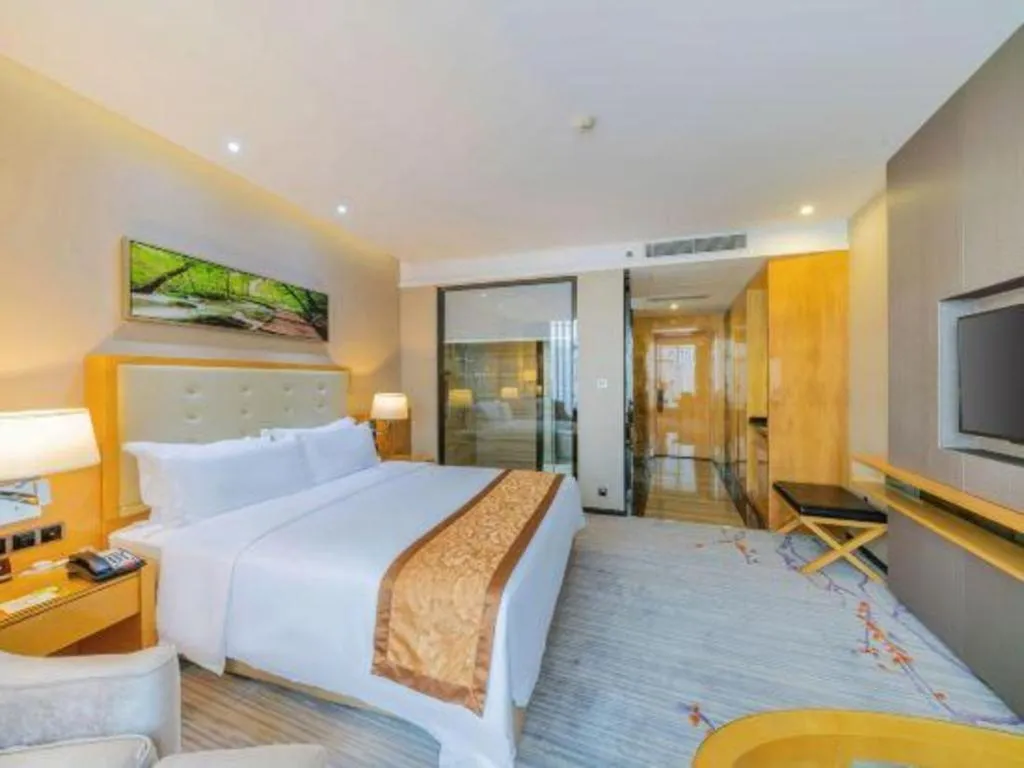 Bed in Golden Phoenix International Hotel