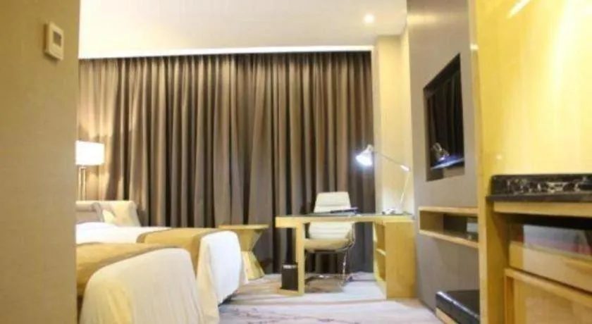 Bed in Golden Phoenix International Hotel