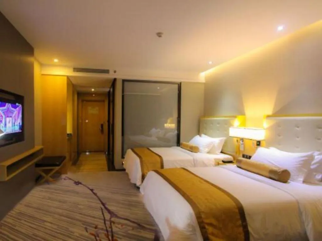 Bed in Golden Phoenix International Hotel