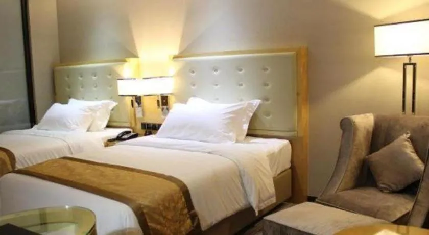 Bed in Golden Phoenix International Hotel