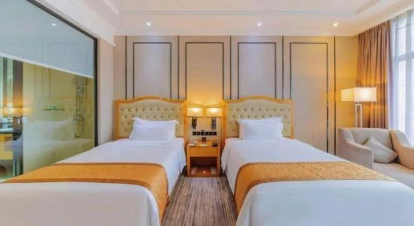 Bed in Golden Phoenix International Hotel