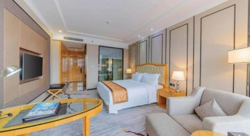 Bed in Golden Phoenix International Hotel