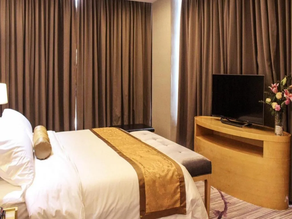 Bed in Golden Phoenix International Hotel