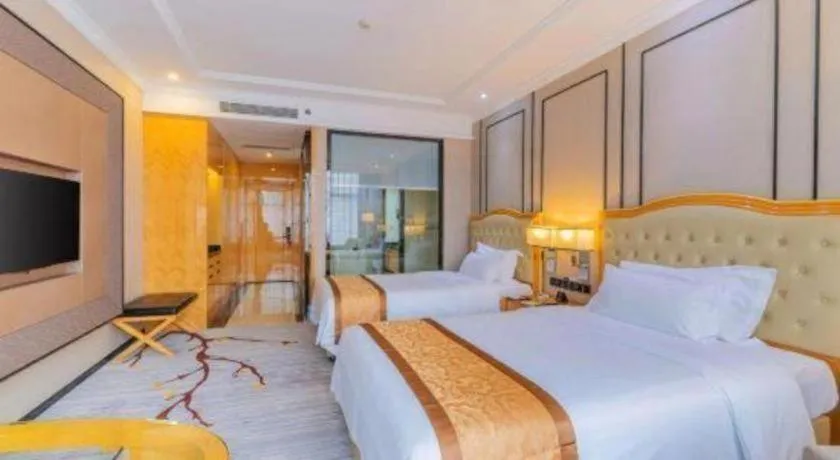 Bed in Golden Phoenix International Hotel