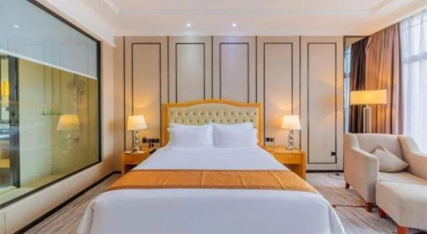 Bed in Golden Phoenix International Hotel