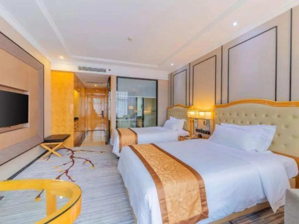 Bed in Golden Phoenix International Hotel