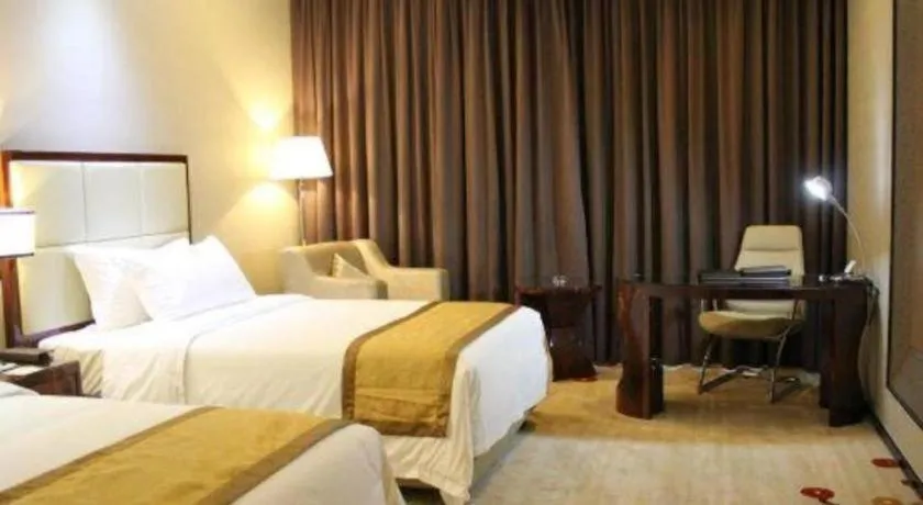 Bed in Golden Phoenix International Hotel