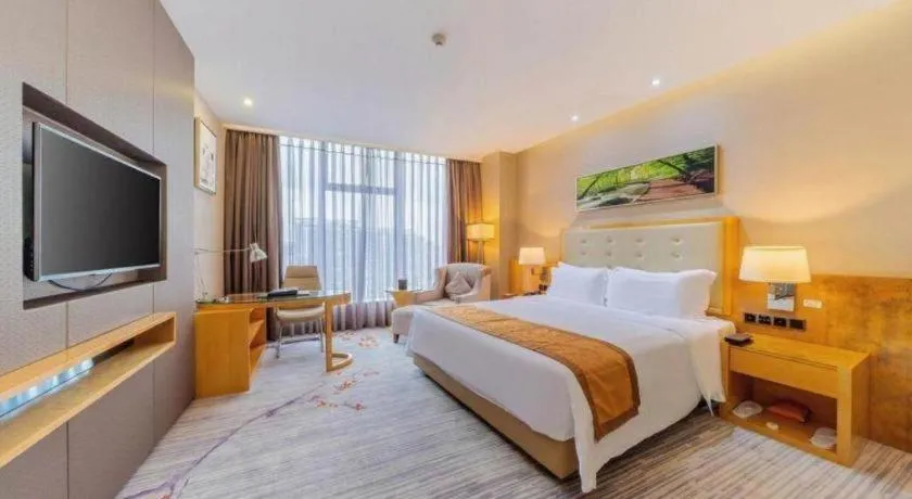 Bed in Golden Phoenix International Hotel