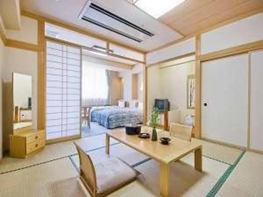 Bed in Hotel Hikyounoyu