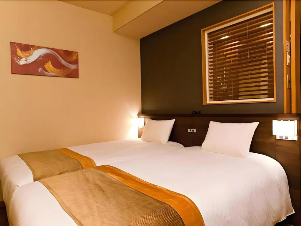 Bed in Ochanomizu Hotel Juraku