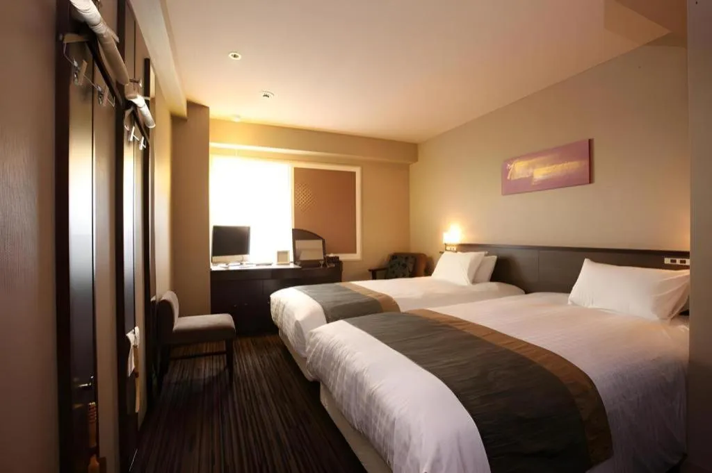 Bed in Ochanomizu Hotel Juraku