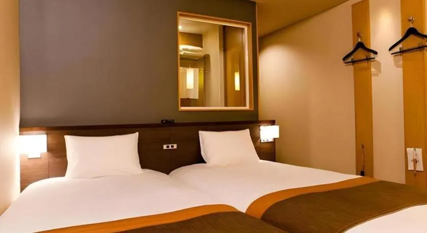 Bed in Ochanomizu Hotel Juraku