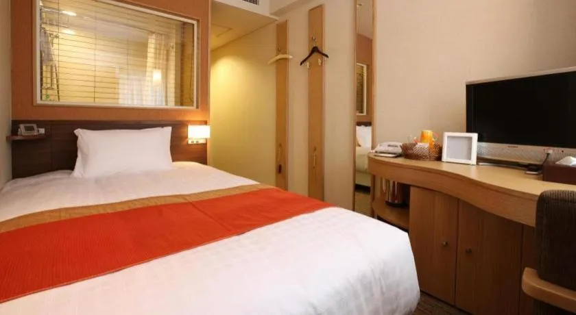 Bed in Ochanomizu Hotel Juraku