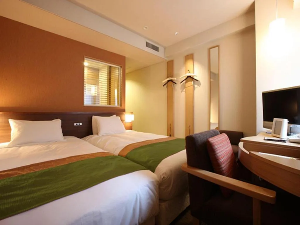 Bed in Ochanomizu Hotel Juraku