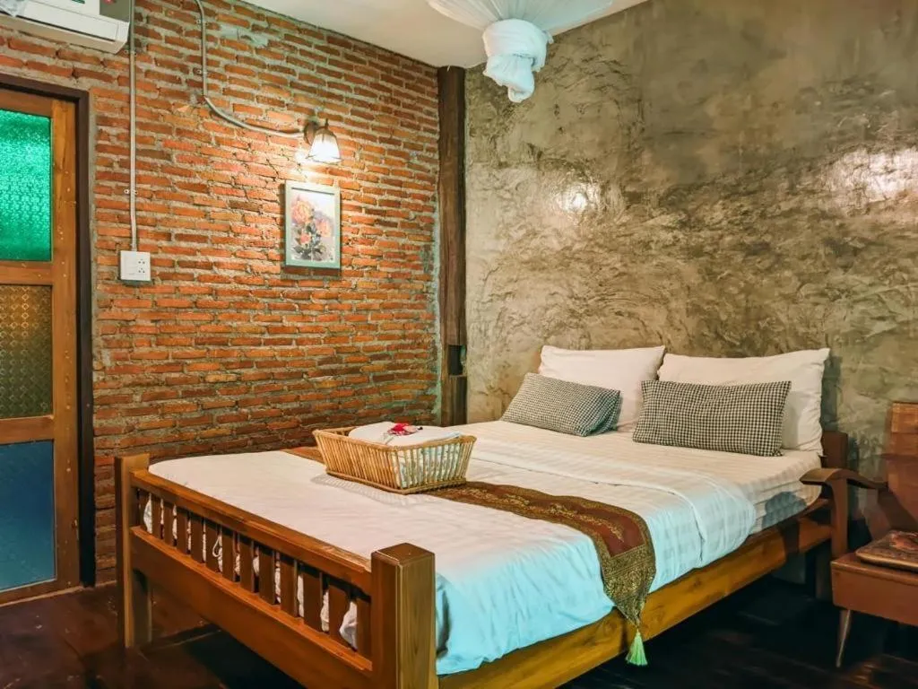 Bed in Huen Chang Puek Hotel