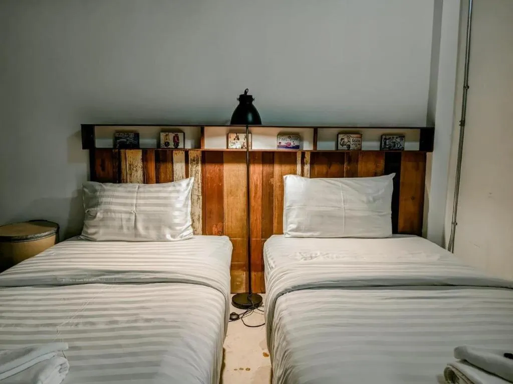 Bed in Huen Chang Puek Hotel