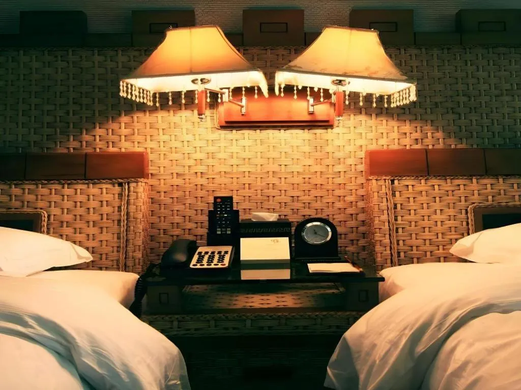 Bed in Fuzhou Chuanjie Hotspring and Golf Club Hotel